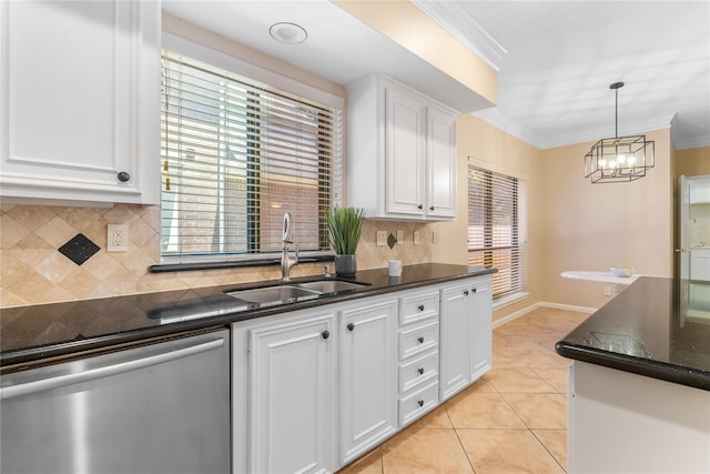 kitchen featuring dishwasher, plenty of natural light, white cabinetry, and sink