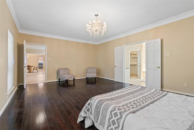 bedroom with dark hardwood / wood-style floors, ornamental molding, and a chandelier