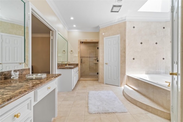 bathroom with a skylight, tile patterned flooring, shower with separate bathtub, vanity, and ornamental molding