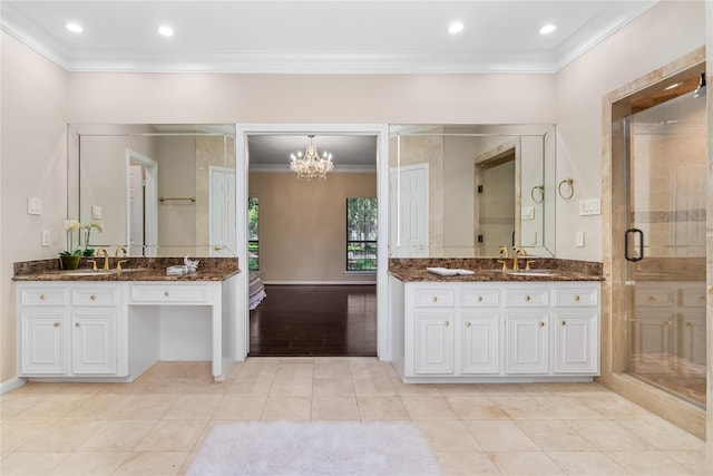 bathroom with tile patterned flooring, vanity, and crown molding