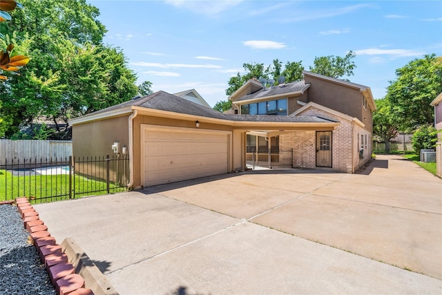 view of front facade with a garage and a front lawn