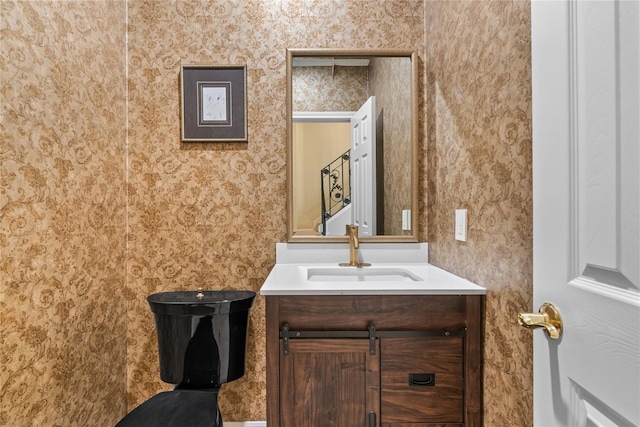 bathroom with vanity and toilet