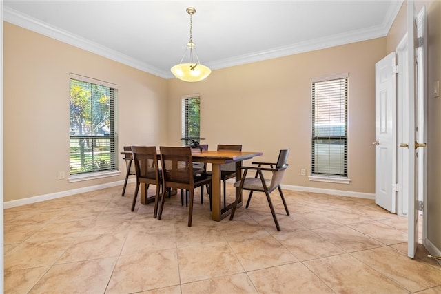 tiled dining area featuring ornamental molding