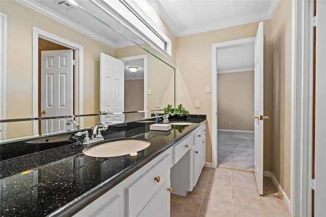 bathroom featuring tile patterned floors, vanity, and crown molding