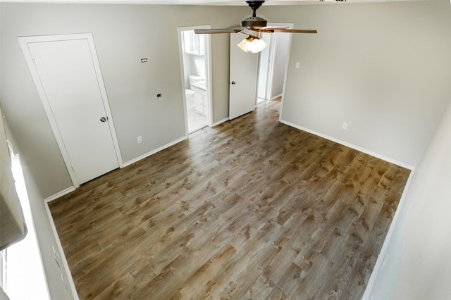 spare room featuring hardwood / wood-style flooring and ceiling fan