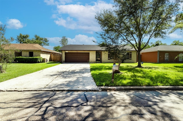 ranch-style house with a front yard and a garage