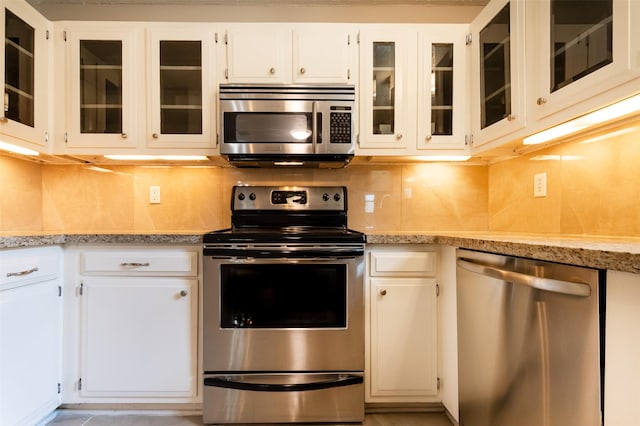 kitchen with white cabinetry and appliances with stainless steel finishes