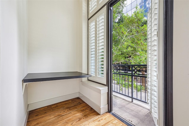 doorway to outside with light wood-type flooring