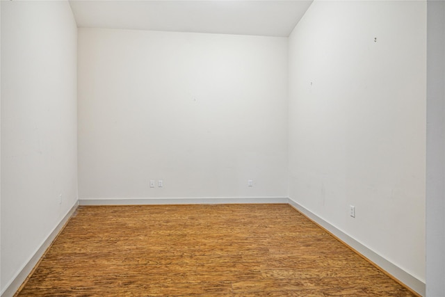 unfurnished room featuring hardwood / wood-style floors