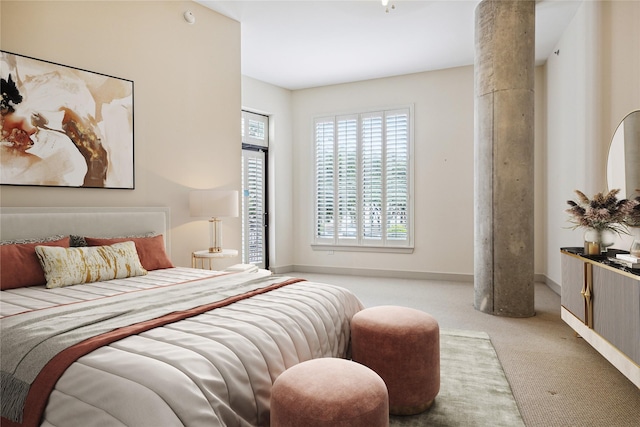 bedroom with light colored carpet