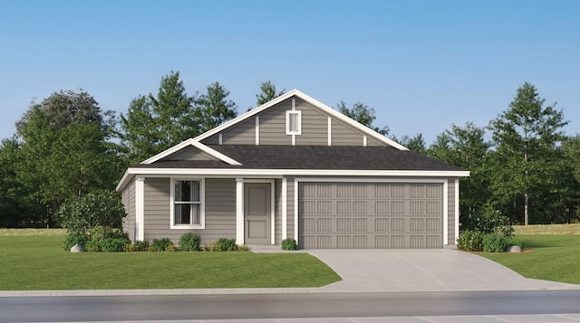 view of front of house featuring a front yard and a garage