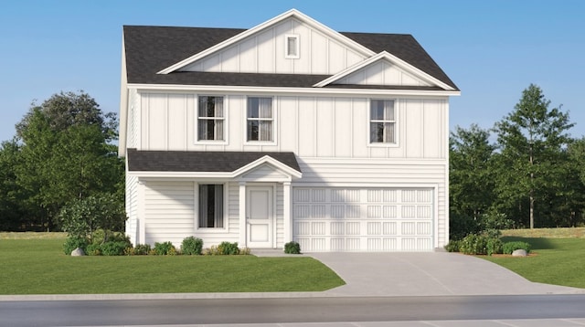 view of front of home featuring a front lawn and a garage