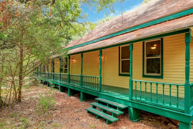 view of property exterior with covered porch