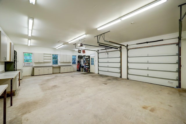 garage with cooling unit and a garage door opener