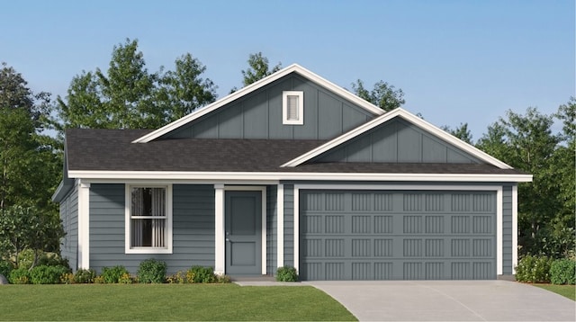 view of front of house featuring a front yard and a garage