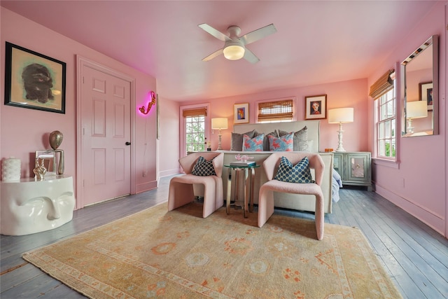 bedroom with wood-type flooring and ceiling fan