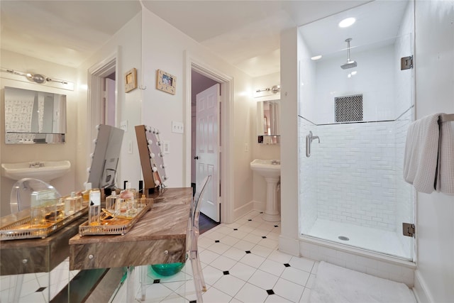 bathroom with tile patterned floors, a shower with door, and sink