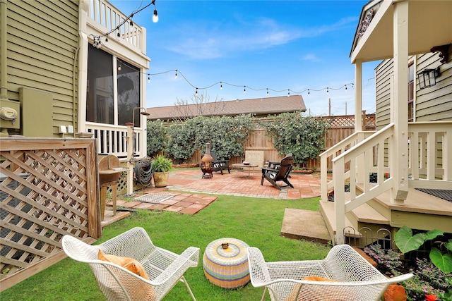 view of yard featuring a patio area and an outdoor fire pit