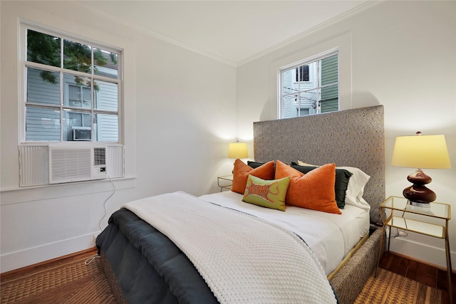 bedroom featuring hardwood / wood-style floors and ornamental molding