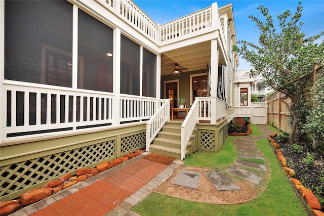 entrance to property featuring ceiling fan