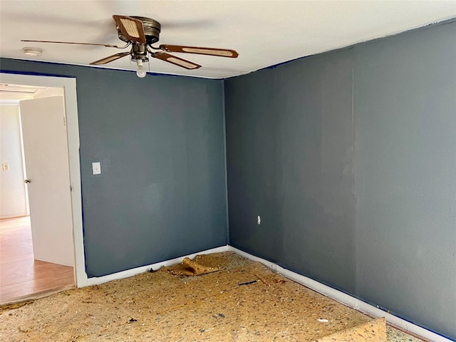 spare room with hardwood / wood-style flooring and ceiling fan