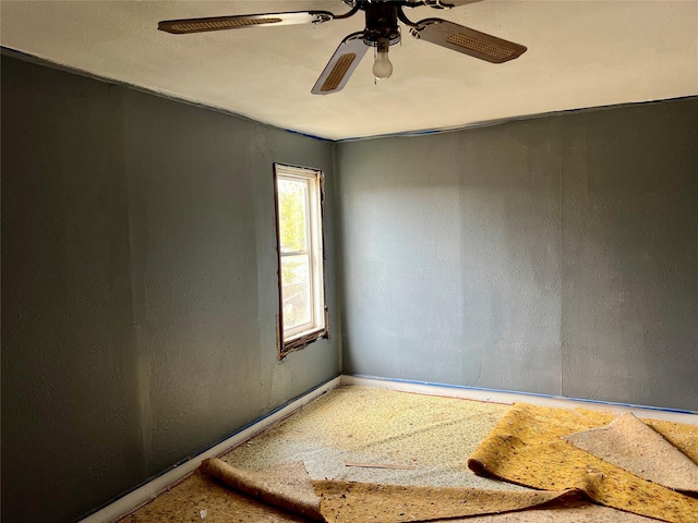 spare room with ceiling fan