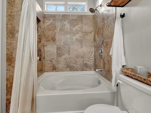 bathroom with toilet and shower / bathtub combination with curtain