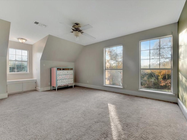 unfurnished bedroom with carpet flooring, ceiling fan, and lofted ceiling