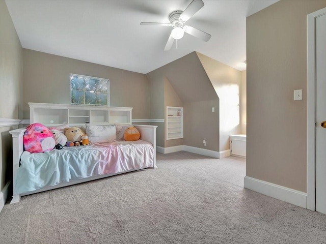 carpeted bedroom featuring ceiling fan and vaulted ceiling