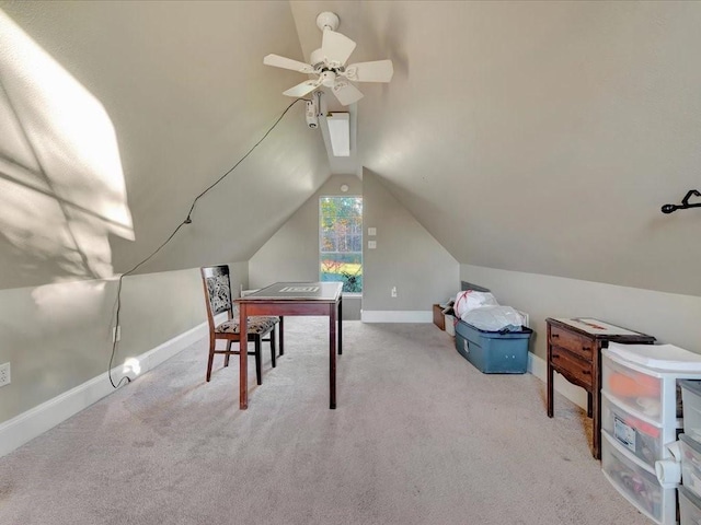 carpeted home office featuring ceiling fan and lofted ceiling