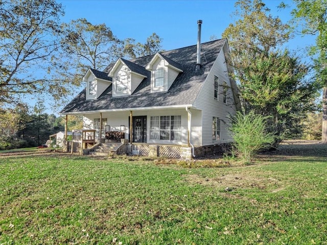 cape cod house with covered porch and a front yard