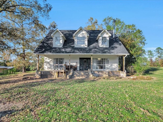 cape cod home with covered porch and a front yard