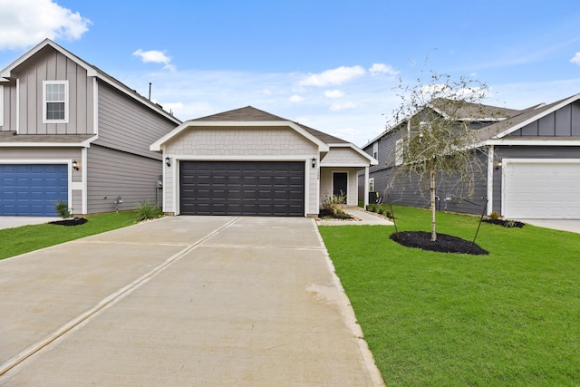 view of front of house featuring a garage and a front yard