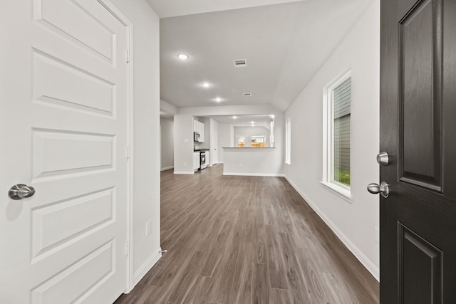 entryway with dark hardwood / wood-style flooring