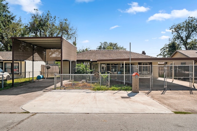 view of front of property featuring a carport