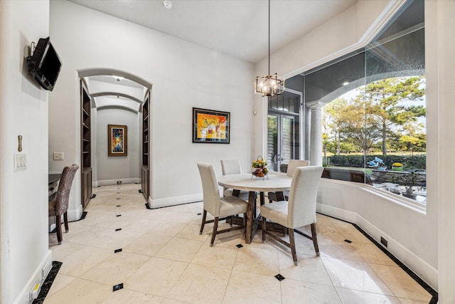 dining space featuring an inviting chandelier