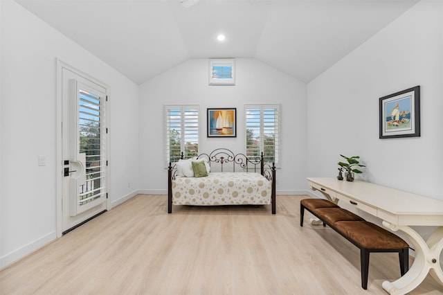 bedroom with light wood-type flooring and lofted ceiling