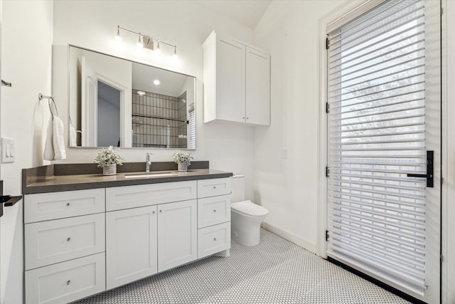 bathroom with tile patterned floors, vanity, and toilet