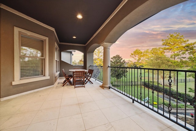 view of balcony at dusk