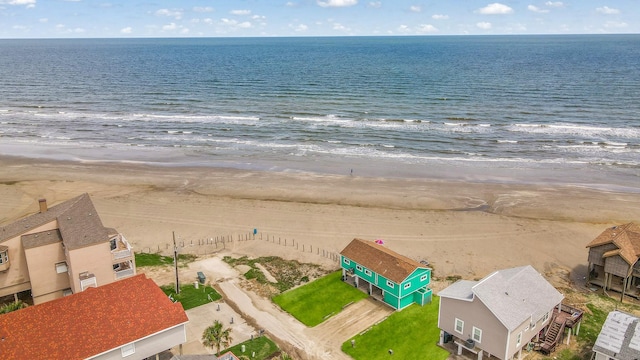 aerial view featuring a water view and a beach view