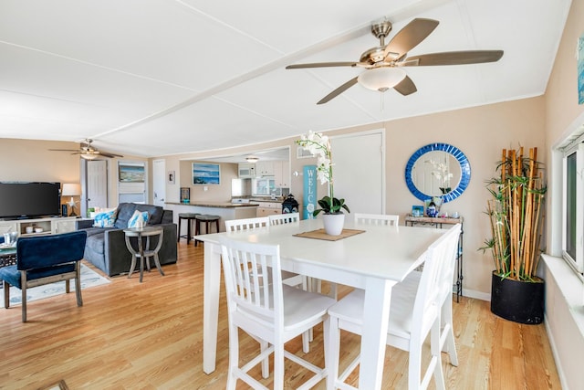 dining room with ceiling fan and light hardwood / wood-style floors