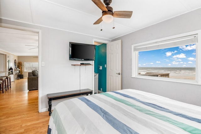 bedroom with light hardwood / wood-style floors and ceiling fan