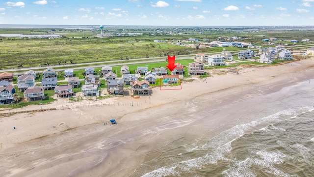 bird's eye view with a view of the beach and a water view