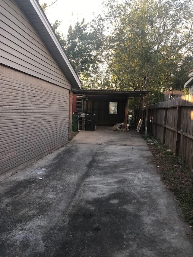 view of home's exterior with a carport