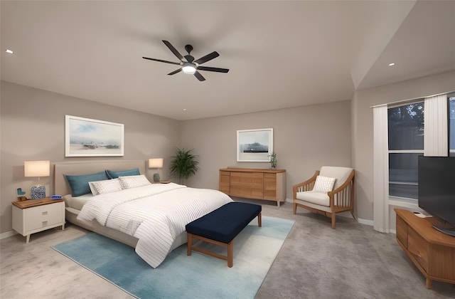 bedroom featuring ceiling fan and light carpet