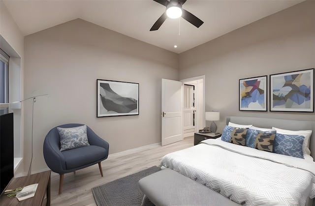 bedroom with ceiling fan, light hardwood / wood-style floors, and vaulted ceiling