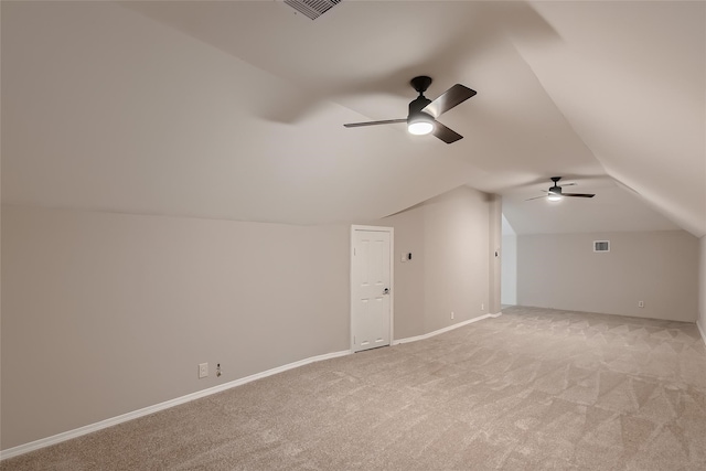 bonus room with ceiling fan, light colored carpet, and lofted ceiling