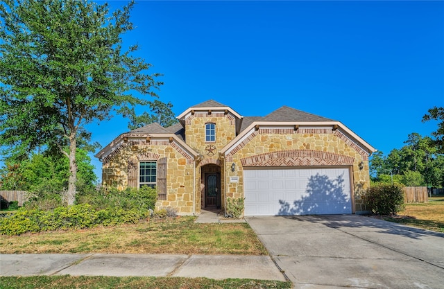 view of front of property with a garage