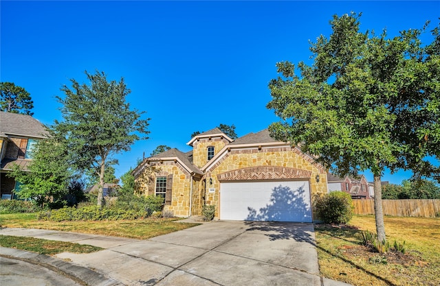 view of front facade featuring a front lawn and a garage