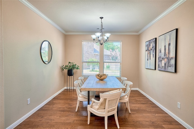 dining area featuring crown molding, wood-type flooring, and a notable chandelier